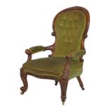 Victorian gentleman's carved walnut framed balloon back open arm drawing room chair standing on