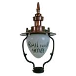 Large early 20th Century copper and wrought iron gas lamp head, the clear and white glass dome