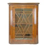 19th Century mahogany hanging corner cabinet having a moulded cornice, split bobbin beading,