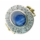 Sapphire and diamond cluster ring, stamped 'K18', the cabochon measuring approximately 8mm x 6.