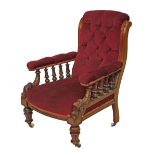 Late Victorian carved walnut framed scroll back drawing room chair, the open arms with turned