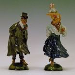 Pair of early 20th Century Portuguese faience rocking figures by Rafael Bordalo Pinheiro, formed