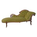 Victorian carved walnut framed chaise longue having a pierced and carved back rail, scroll end and