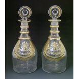 Pair of 19th Century clear glass decanters of tapered form, each having a circular lozenge