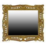 19th Century giltwood and gesso framed rectangular wall mirror having pierced and stylised foliate