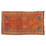 20th Century Quashqui rug having stylised foliate decoration on a red ground within multi borders,