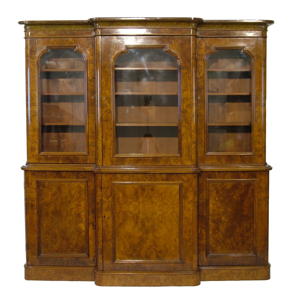 Victorian style figured walnut two section breakfront library bookcase, the upper section fitted