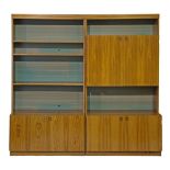 Pair of Danish style rosewood lounge display units, the first fitted four shelves, the cupboards