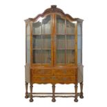 Late 19th/early 20th Century William and Mary style walnut two section display cabinet, the upper