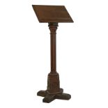 Victorian oak Gothic design lectern standing on a turned and reeded pillar and carved