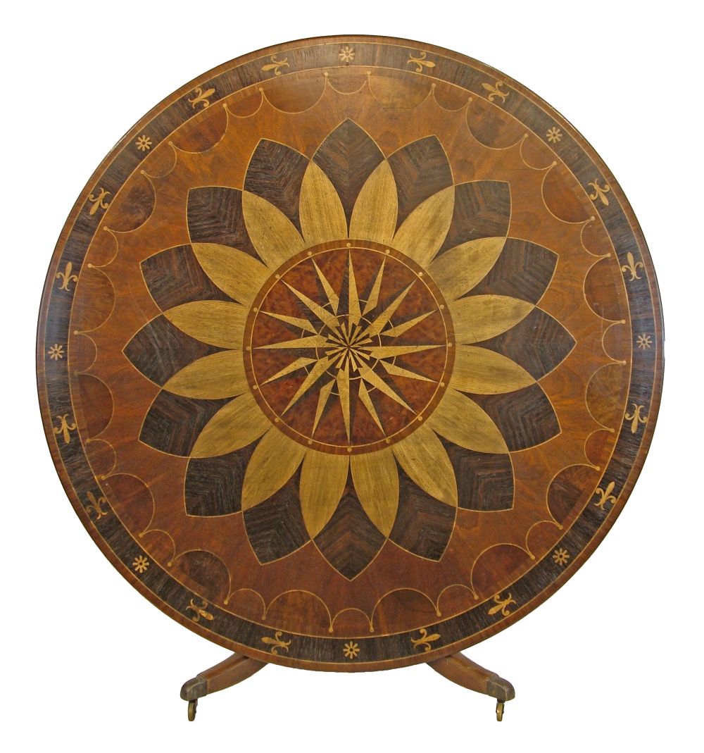 Elaborate parquetry inlaid circular snap top dining table standing on a turned pillar and
