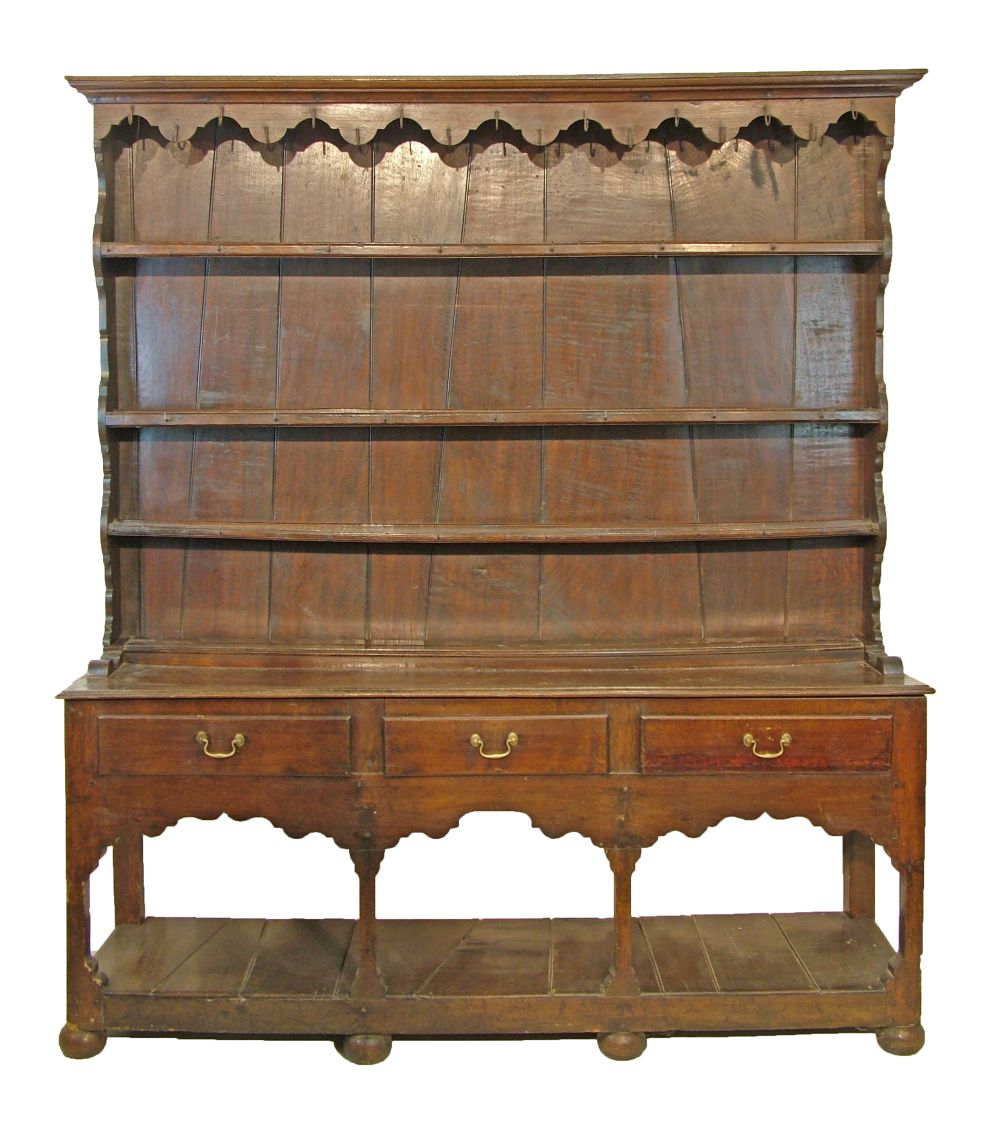 18th Century and later oak Welsh dresser, the plate rack with moulded cornice, shaped apron below