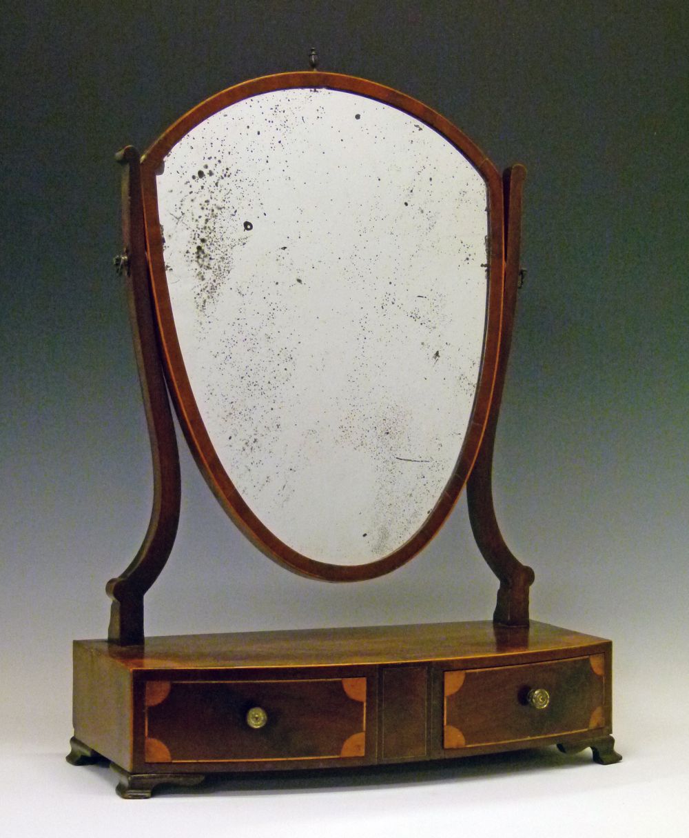 George III crossbanded mahogany shield shaped dressing table mirror, the box base fitted two short