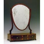 George III crossbanded mahogany shield shaped dressing table mirror, the box base fitted two short