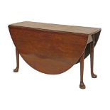 George III mahogany oval two flap dining table standing on tapered pad supports, 119cm x 160cm