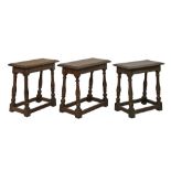 Three antique 17th Century style oak joint stools, each standing on turned supports united by