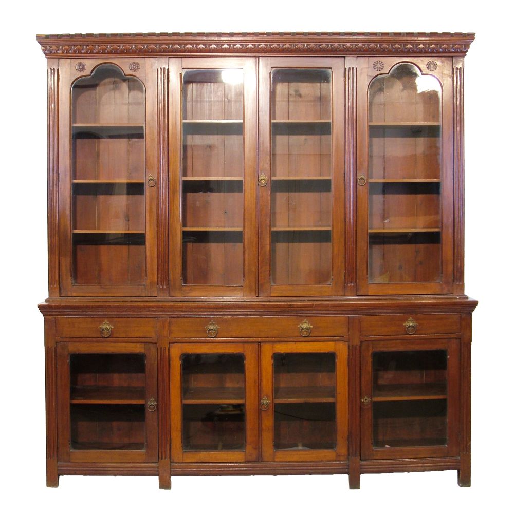 Victorian walnut Gothic design two section library bookcase, the upper section having a moulded