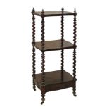 Victorian rosewood three tier what-not, the shaped shelves supported by barley twist columns, a