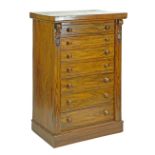 Victorian walnut Wellington chest fitted seven short drawers flanked by a folding locking