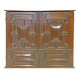 Antique oak Jacobean style cupboard, the two doors with geometric mouldings, 94cm wide  Condition: