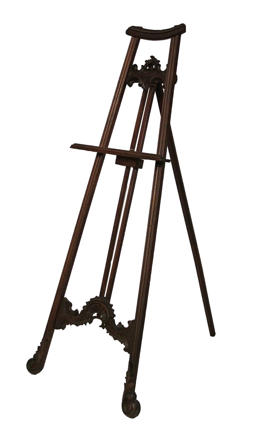 Carved mahogany and beech floor standing easel standing on scroll supports, overall height 166cm