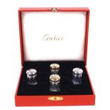 CARTIER, QUATTRO SALIERINE IN ARGENTO XX Sec. entro astuccio, h. cm. 3,5  A SET OF CARTIER