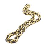 COLLIER IN ORO GIALLO 18KT E ARGENTO lavorato a maglie intrecciate, chiusura ad uncino, lunghezza