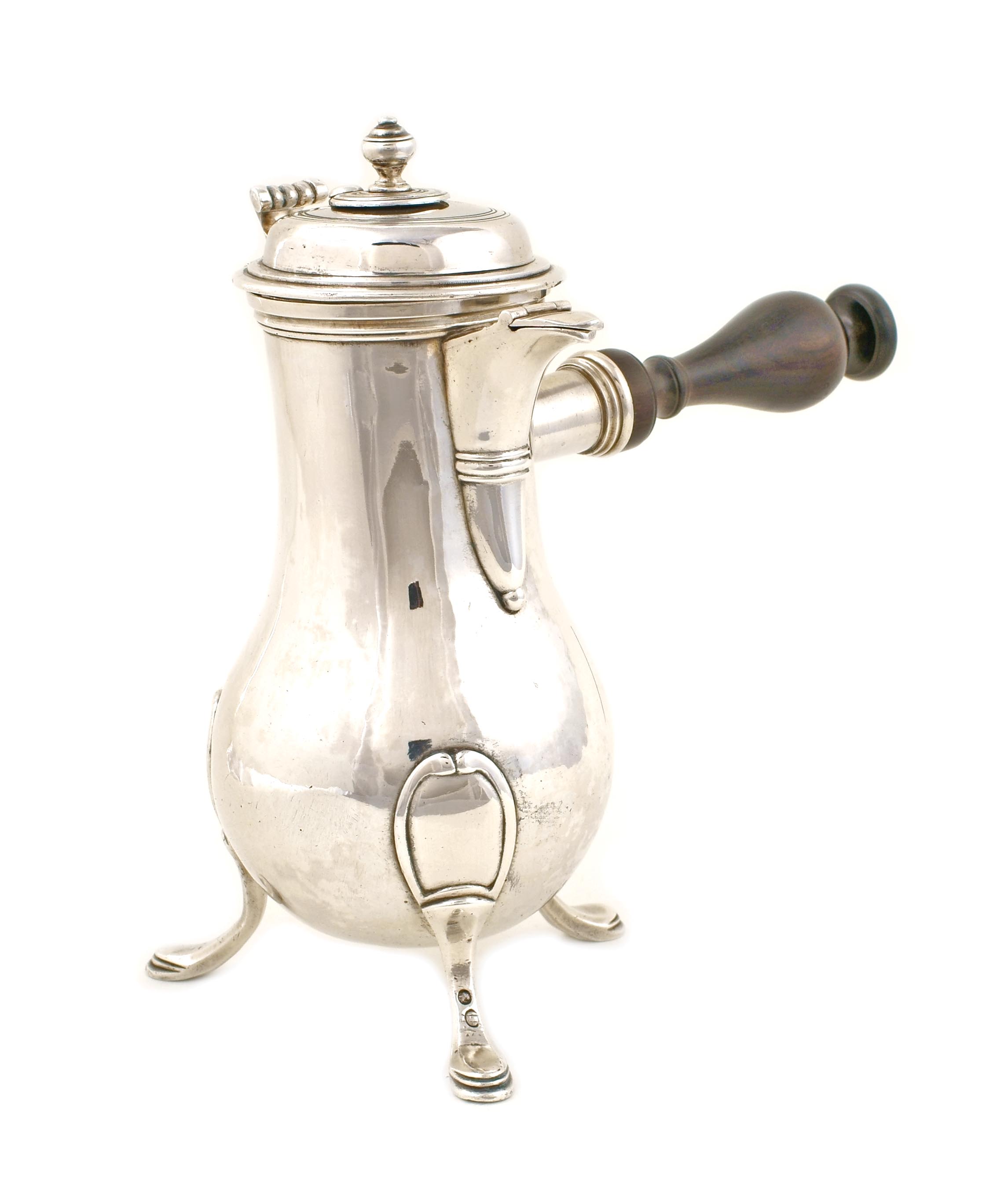 A French silver chocolate pot Plain silver baluster on three feet with ebony handle Paris, 18th