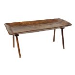 An Italian oak table the top was substituted with an antique element and is standing on four not