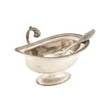 An Italian silver sugar bowl Comprising spoon, minor defects 20th century peso 178 gr.