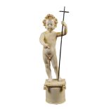 An antique French ivory sculpture modelled as Child Jesus indicating the cross. Gross weight: 2214