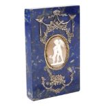A lapis lazuli paper weight plaque With in the centre a shell cammeo and silvered metal decorations,