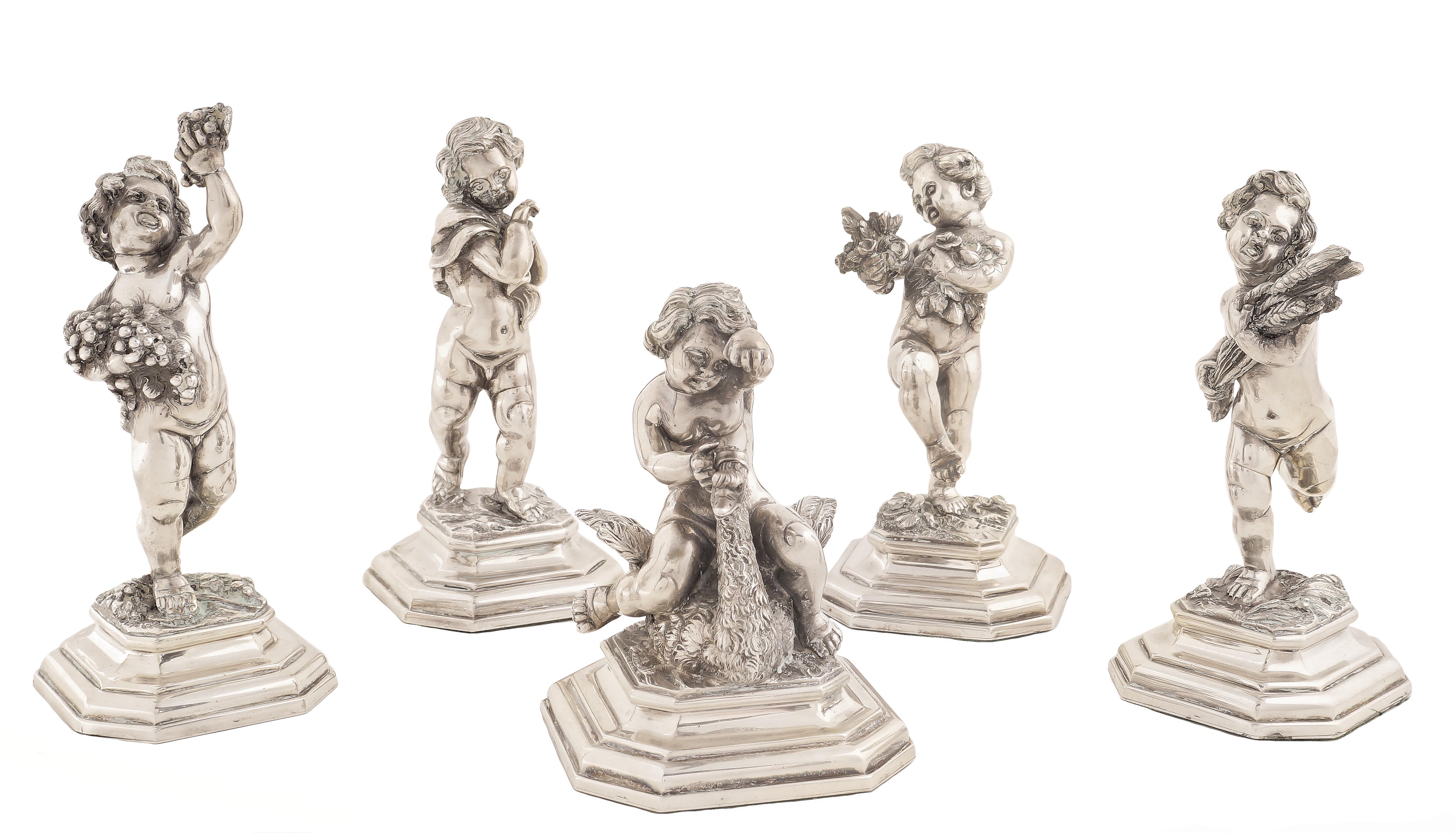 A lot of five silver putti Repoussé and chasing decorations of the four seasons mid 20th century