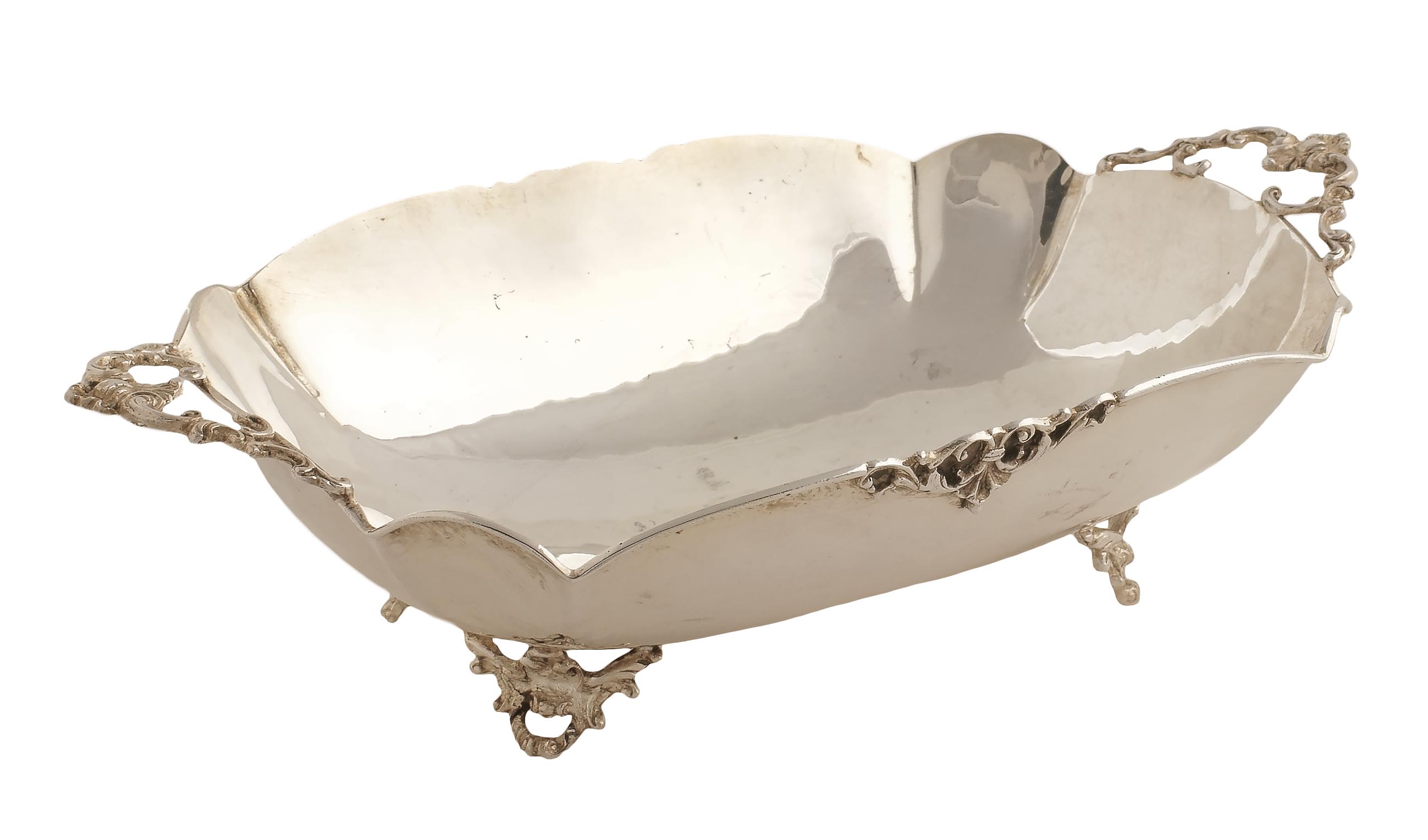 An Italian silver centerpiece with two handles Plain silver on four scroll-shaped feet 20th