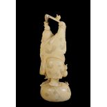 A Chinese ivory sculpture Modelled as a wanderer with kimono and brisé fan, Fongoli Foligno