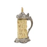 A German silver and ivory tankard The whole body is overall engraved with knights and soldiers,