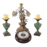 A mixed lot (4) Comprising a pair of lacquered wooden candelabra, a barometer and a bronze
