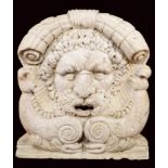 A Roman white marble mascaroon Modelled as the Roman god Neptune. In general the mascaron