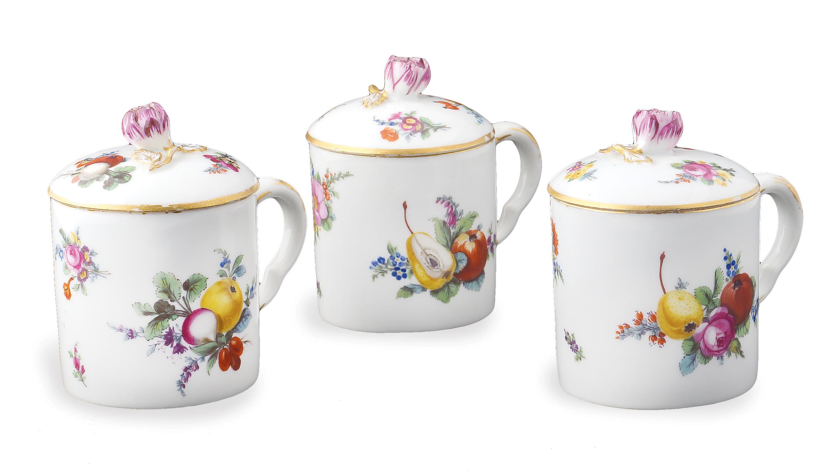 A Meissen set of three porcelain cups Decorated with fruits and flowers, gilt rim, mark under the