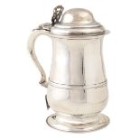 An English silver tankard On circular base and with fine repoussé and chasing decorations all over