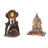 A mixed wood lot Two engraved figures, one modelled as the head of an Oriental god and the other