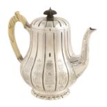 A William IV silver teapot Silversmith Robert Garrad, ivory handle and decorated with geometric