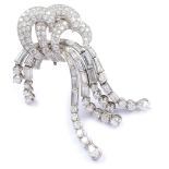 An extraordinary platinum and diamond brooch Brilliant-, oval- and baguettes-cut diamonds weighing