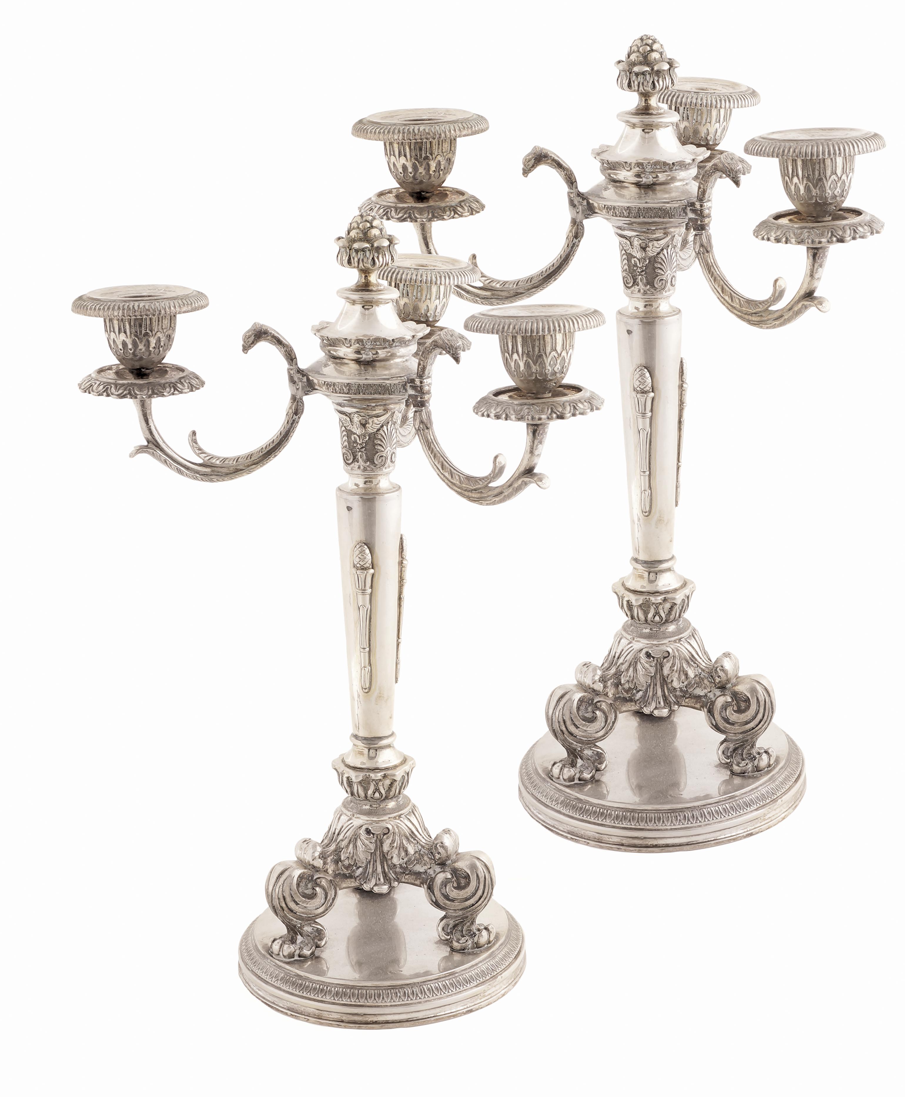 A pair of Italian silver three-branch candelabra Repoussé and chasing decorations mid-20th century