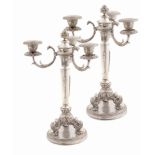 A pair of Italian silver three-branch candelabra Repoussé and chasing decorations mid-20th century