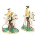 A Nymphenburg porcelain figure Modelled as two mounted huntsmen, mark and date on the base, minor