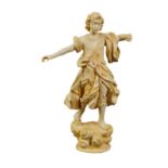 An antique Italian ivory sculpture modelled as the Archangel Gabriel standing on a scroll-shaped