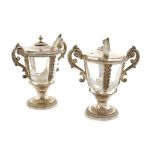 A pair of French silver saltcellars body decorated with repoussé and palmette chasing, glass