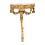 A French giltwood console with mirror festoon and scroll-shaped decorations and at the upper part of