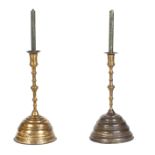 A pair of Italian bronze candelabra decorated with foliage and scroll-shaped elements and standing